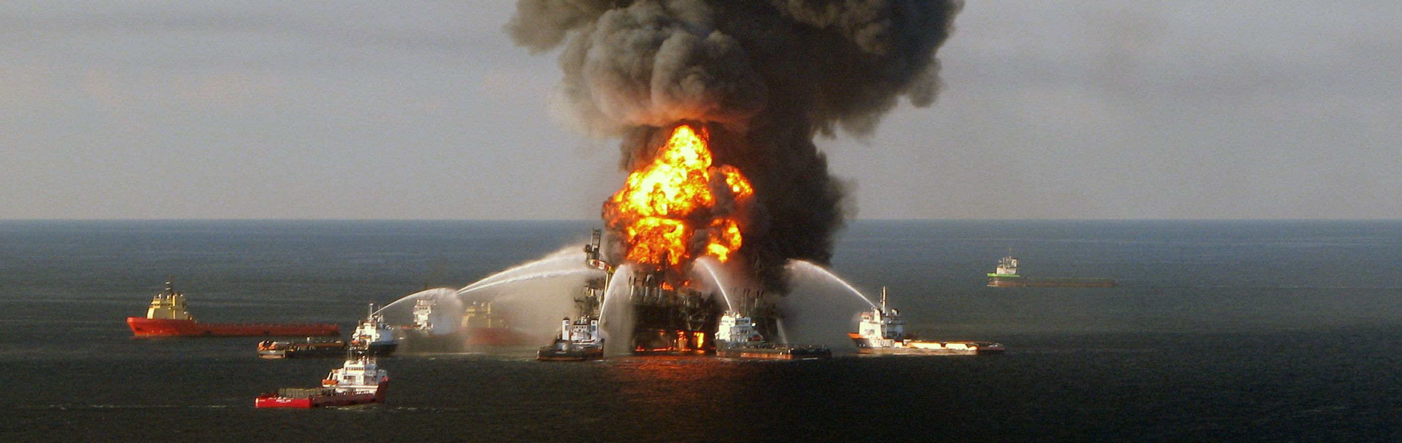 Fire boat response crews battle the blazing remnants of the BP-operated Deepwater Horizon offshore oil rig in the Gulf of Mexico in April 2010. | U.S. COAST GUARD / AFP-JIJI